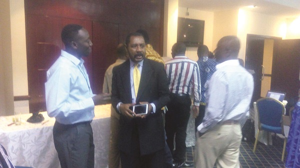 Mr Nanga Kaye (left), Country Coordinator of ENVAC, chatting with some of the participants at the launch Mr Nanga Kaye (left), Country Coordinator of ENVAC, chatting with some of the participants at the launch
